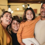 Happy latin family portrait at home on patio