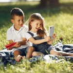 Cute children with watermelons in a park