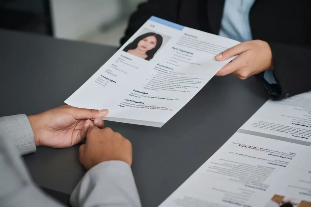 Woman giving her documents to get visa