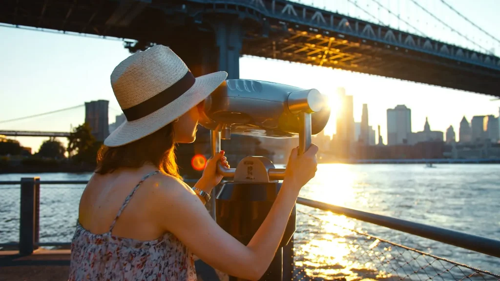 Young tourist on the view point at sunset