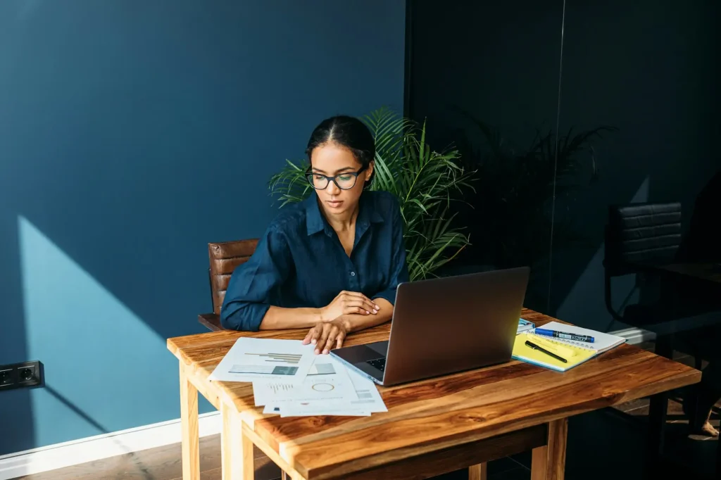 Young woman working with documents from home