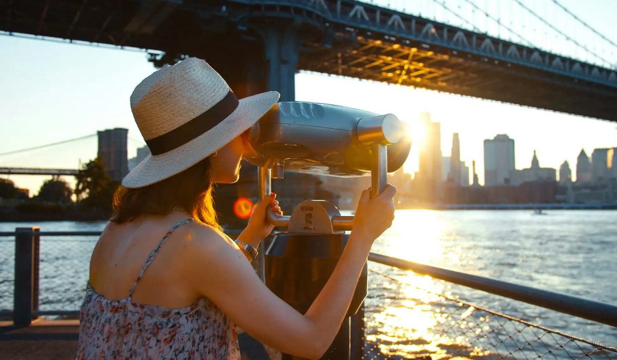 Young tourist on the view point at sunset